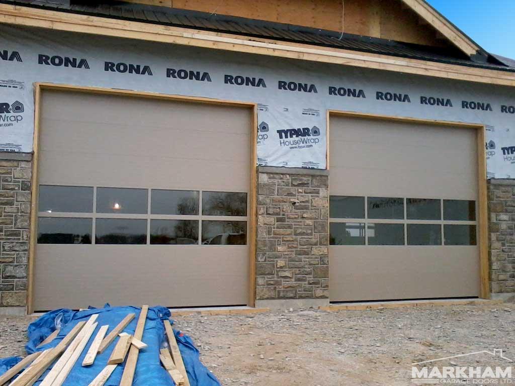 Sandstone-Commercial-Garage-Doors-with-Glass-Sections-Full-view