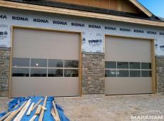 Sandstone-Commercial-Garage-Doors-with-Glass-Sections-Full-view