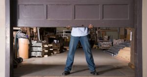 technician balancing a garage door