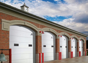 white commercial garage doors installed at a firehouse