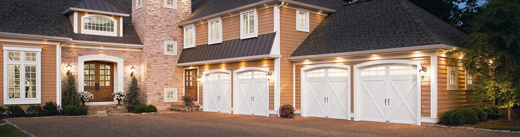 white garage doors with windows at night
